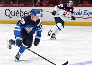 MONTREAL, CANADA - DECEMBER 27: Finland's Mikko Rantanen #16 carries the puck over the blue line against Team Slovakia during preliminary round action at the 2015 IIHF World Junior Championship. (Photo by Richard Wolowicz/HHOF-IIHF Images)

