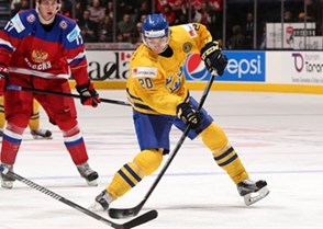 TORONTO, CANADA - DECEMBER 29: Sweden's Adam Brodecki #20 lets a shot go during preliminary round action against Russia at the 2015 IIHF World Junior Championship. (Photo by Andre Ringuette/HHOF-IIHF Images)


