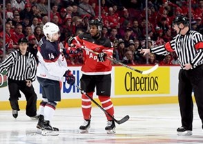 MONTREAL, CANADA - DECEMBER 31: Canada's Anthony Duclair #10 clashes with USA's Tyler Motte #14 before the puck drops to start the game during preliminary round action at the 2015 IIHF World Junior Championship. (Photo by Richard Wolowicz/HHOF-IIHF Images)