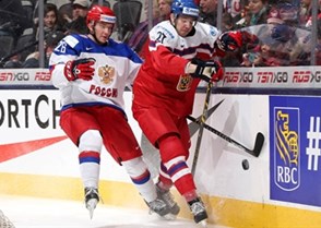 TORONTO, CANADA - DECEMBER 31: Czech Republic's Dominik Masin #27 and  Russia's Vladimir Bryukvin #26 battle for the puck during preliminary round action at the 2015 IIHF World Junior Championship. (Photo by Andre Ringuette/HHOF-IIHF Images)

