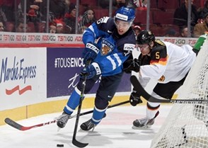 MONTREAL, CANADA - DECEMBER 31: Finland's Mikko Rantanen #16 stickhandles the puck with Germany's David Trinkberger #5 chasing during preliminary round action at the 2015 IIHF World Junior Championship. (Photo by Richard Wolowicz/HHOF-IIHF Images)

